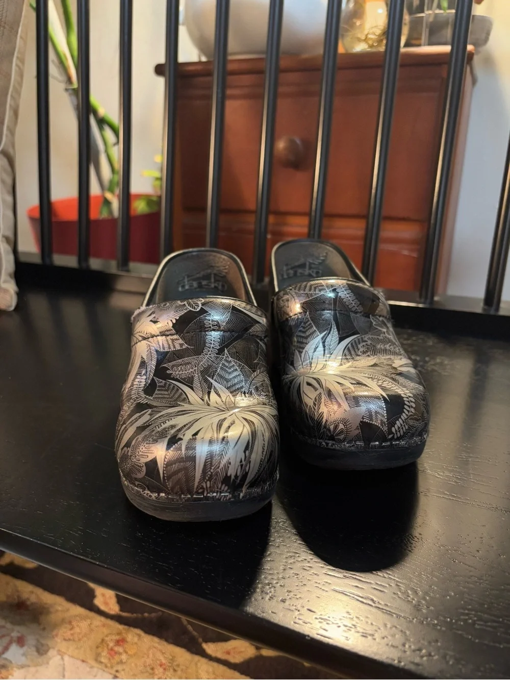 Dansko Black Clogs with Silver Floral Print